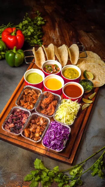 Sampler board of sauces and grilled sides