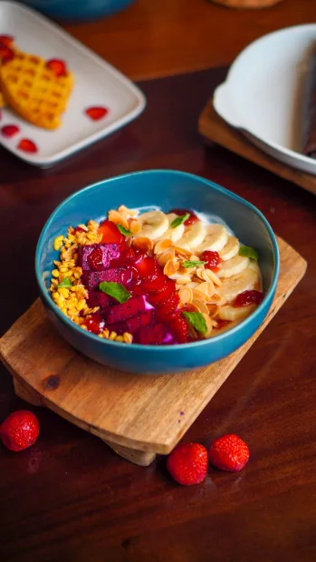 Colourful rice bowl on a wooden board