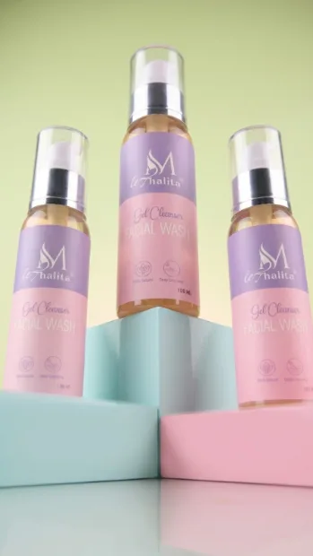 Three mist bottles on pastel steps