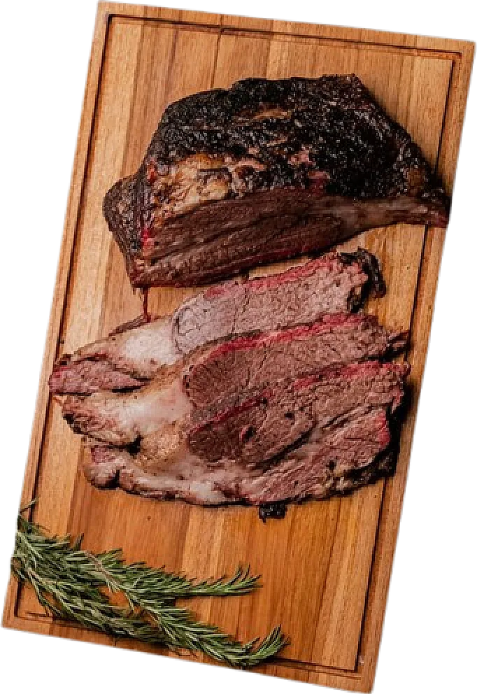 Fifteen-hour slow-smoked beef brisket, sliced on a wooden board with rosemary